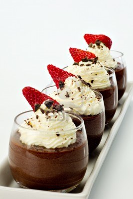 10905247-chocolate-mousse-for-four-topped-with-whipped-cream-dark-chocolate-shavings-and-a-strawberry